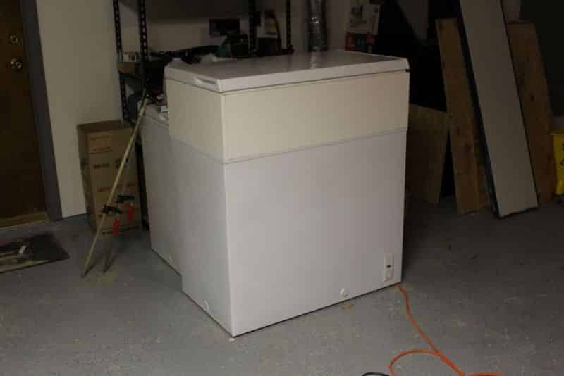 Melamine shelving screwed into collar frame with lid resting on top #1