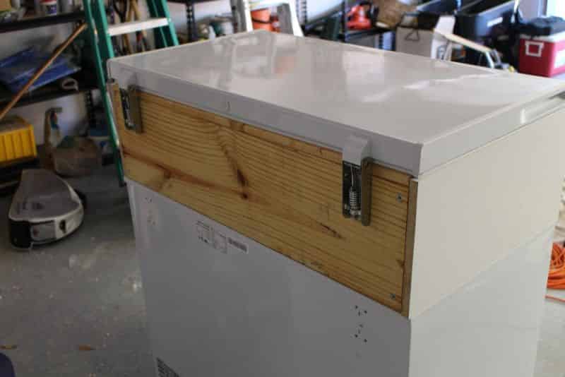 Rear view of freezer lid attached to collar