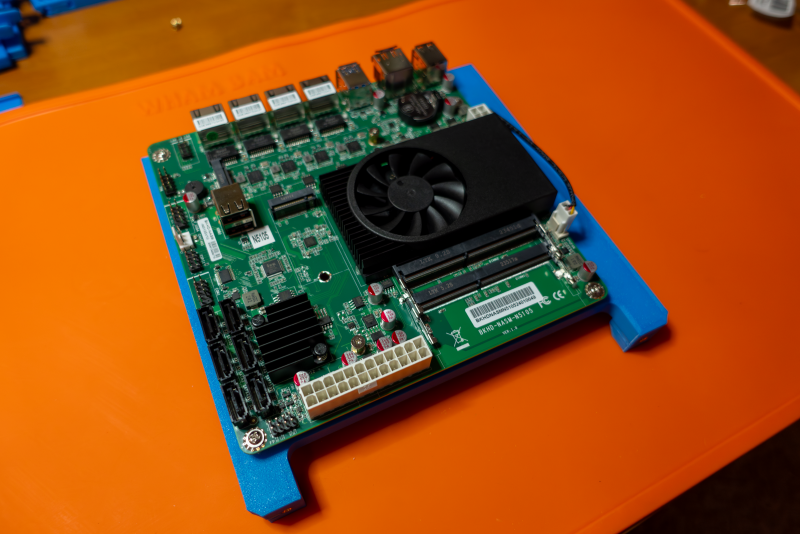 Installing the motherboard on 3D-printed top of the lower chamber.